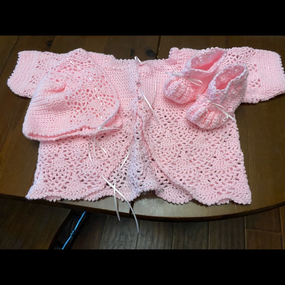 Crocheted layette set.